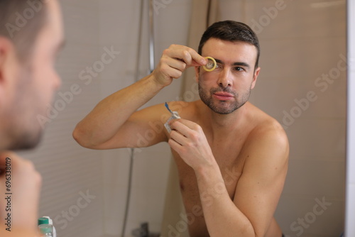 Man opening a condom to practice safer sex 