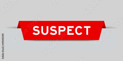 Red color inserted label with word suspect on gray background