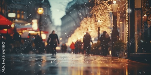 A group of people walking down a street in the rain. This image can be used to depict urban life and rainy weather