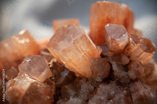 Orange aragonite crystal. Close-up raw rough unpolished semi-precious gemstone