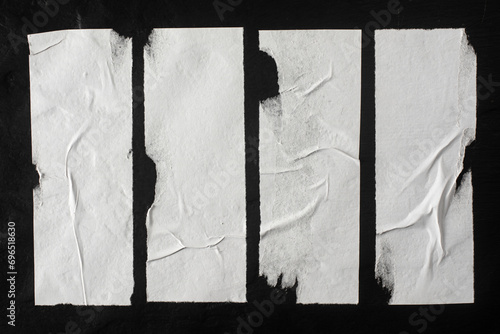 Strips of white crumpled paper with folds as a background.