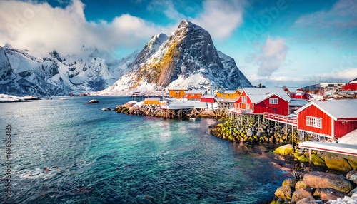 attractive morning scene of sakrisoy village norway europe bright winter view of lofoten islads witj typical red wooden houses beautiful seascape of norwegian sea traveling concept background