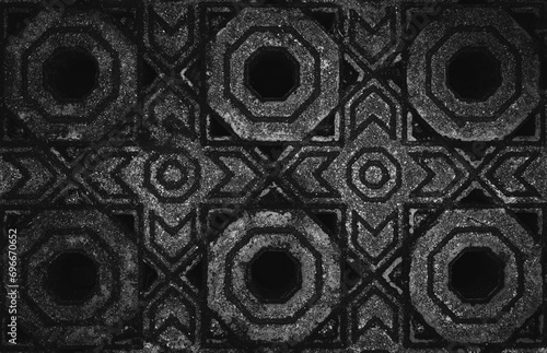 Ornamental paving tile, black and white toned image 