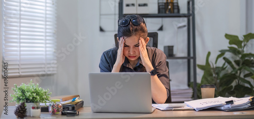 Puzzled confused asian woman thinking hard concerned about online problem solution looking at laptop screen, worried serious asian businesswoman focused on solving difficult work computer task