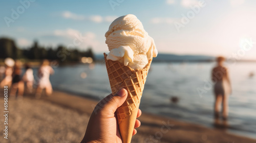 This image features an individual enjoying a vanilla gelato on a sunny beach, with family and friends in the background, embodying the essence of a wonderful summer day.