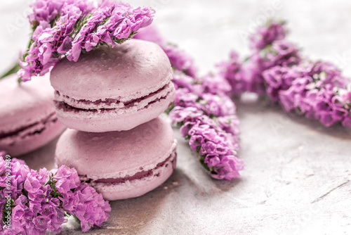 lady morning with macaroons and mauve flowers white desk background