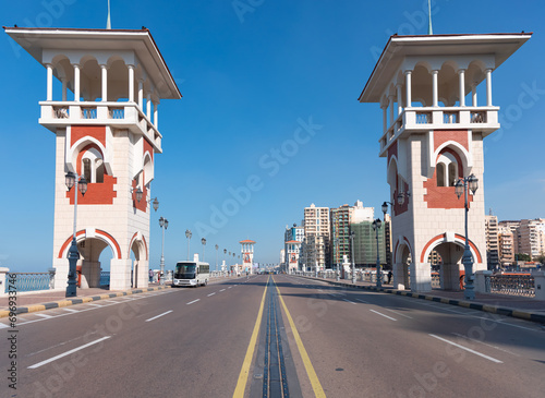 People walk the Stanley Bridge, popular landmark of Alexandria, Egypt