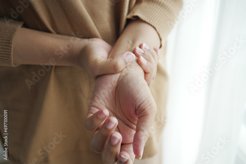  Young women hands suffering wrist pain, 