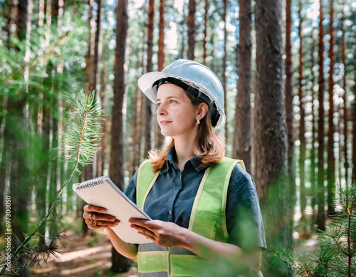 Female Ecologist Inspecting Beautiful Green Landscape in Forest