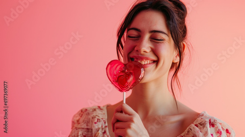 cheerful woman having a lollipop heart shaped