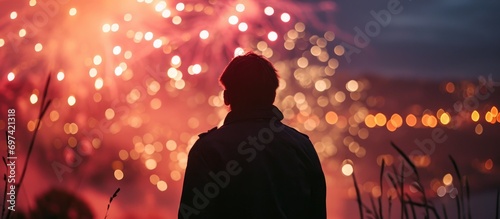 Man setting off fireworks silhouette.