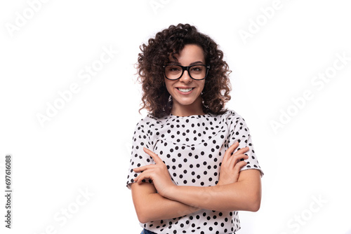 young stylish caucasian woman with curly perm hair looks happy and confident