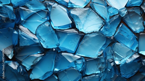 Close-up shot of a shattered blue glass, depicting the fragmented beauty of brokenness. Purpose ambiguous