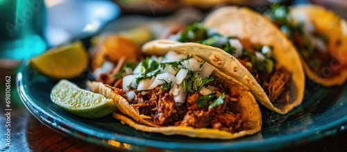 Four Tacos served on a plate