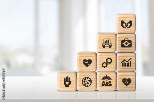 Employee benefits, hand hold wooden cubes