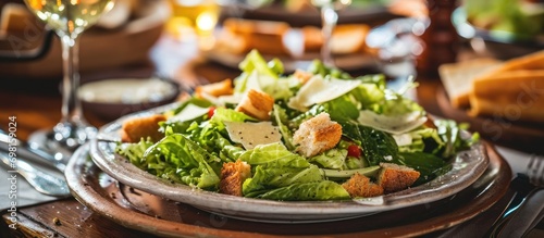 Caesar salad on table.