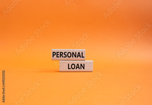 Personal Loan symbol. Concept word Personal Loan on wooden blocks. Beautiful orange background. Business and Personal Loan concept. Copy space