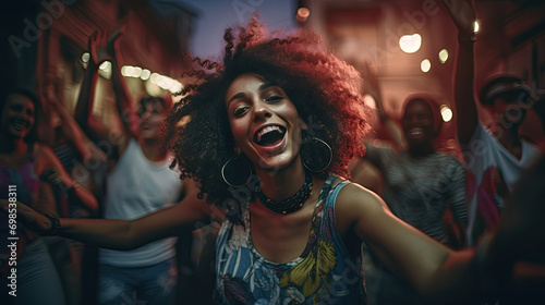 Portrait of cheerful young woman enjoying at music festival. A young woman is dancing at a concert having a good time at an open air venue in the night.