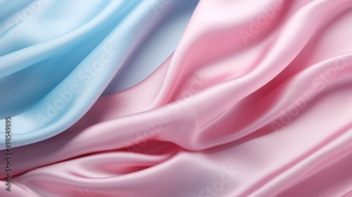Smooth folds of satin undulate in a dance of pastel pink and baby blue under soft lighting.