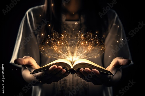 A woman holds an open book with both hands.