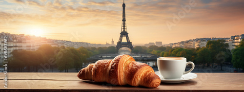 delicious hot coffee and croissant against the background of the Eiffel Tower