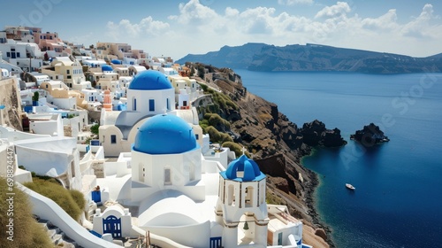 A picturesque Greek village with white-washed buildings, blue domes, and sea views.