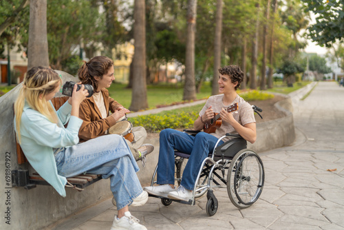 Friends having fun playing music and taking photos outdoors