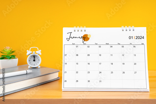 January desk calendar for 2024 year on work table.
