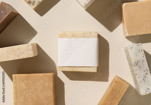 Beige and brown soap bars on light beige close up, hard shadows, packaging mockup