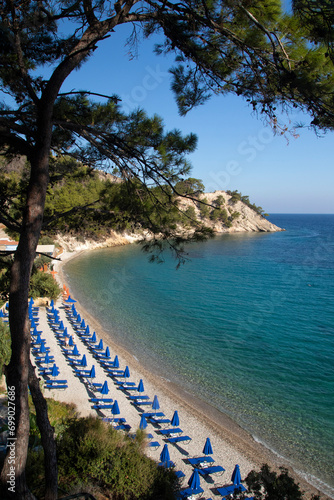 Lemonakia beach, pebble beach with crystal water and pine forest on the Samos island in Greece