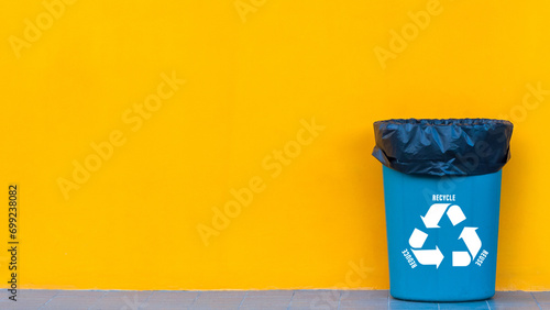 Reduce, reuse, recycle symbol with garbage bin on yellow background, Ecological concept, ecological metaphor for ecological waste management and sustainable and economical lifestyle.