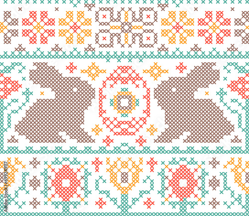 Seamless pattern with Easter bunnies and eggs in cross stitch style