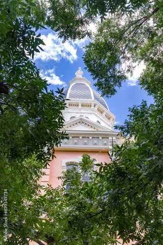 Vertical: The pink colored Empire Style architecture Presidio County Courthouse in Marfa, Texas has been added the National Registry of Historic Places.