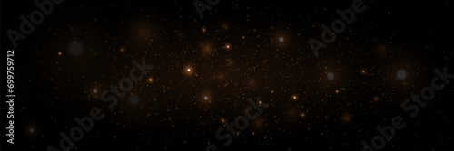 Gold dust light and glare particles. Magic light effect. Christmas glowing dust background.