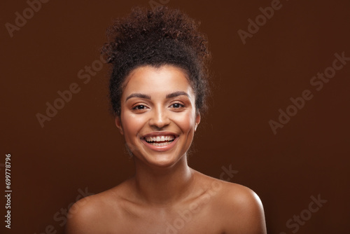 Beauty portrait of afro woman with amazing natural toothy smile .