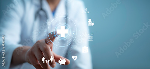 .A medical worker using virtual with health care icons, medical technology background, health insurance business.Health Insurance, telemedicine, virtual hospital, family medicine concept.