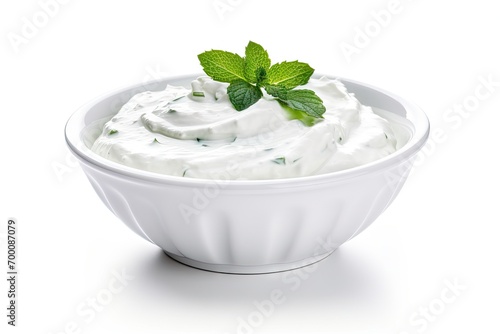 Isolated bowl of tzatziki sauce with sour cream or Greek yogurt on white background