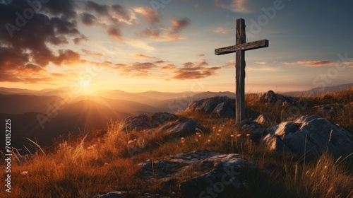 Holy christian religious cross at sunrise on top of hill crucifix