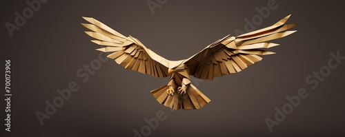 Flying brown origami paper eagle isolated on brown background. Folded paper bird sculpture
