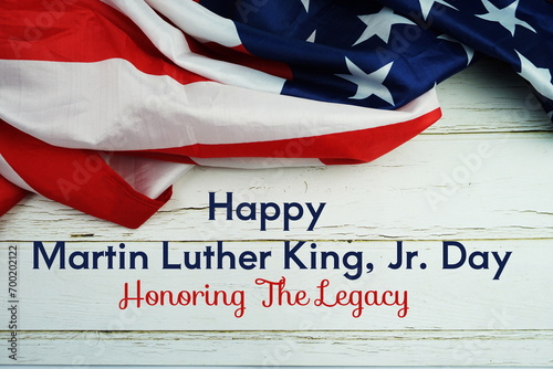 Happy Martin Luther King Jr Day text messege with USA flag on wooden background