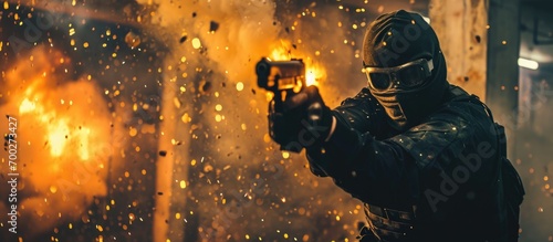 Masked terrorist with gun setting off explosives in a room, showing anger.