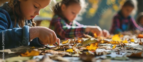 Children engage in a hands-on autumn art workshop, crafting with glue, scissors, and natural materials, promoting creativity and outdoor education.