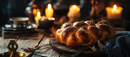Challah Jewish Bread traditionally baked to celebrate the Shabbat The inscriptions on the tablecloth translated from Hebrew means Shabbat Shalom peaceful Saturday Jewish holiday Israel