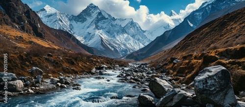 Himalaya mountains and stream water from melted glacier view from Bimthang village in Manaslu circuit trekking route in Nepal Asia. Creative Banner. Copyspace image