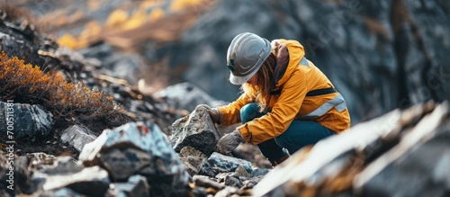 Female geologist researcher analysing a rock at her workplace. Creative Banner. Copyspace image