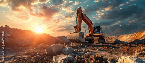 Excavator in open pit mining Excavator on earthmoving on sunset Loader on excavation Earth Moving Heavy Equipment Earth mover ar construction site Backhoe Loader on Road construction. Creative Banner