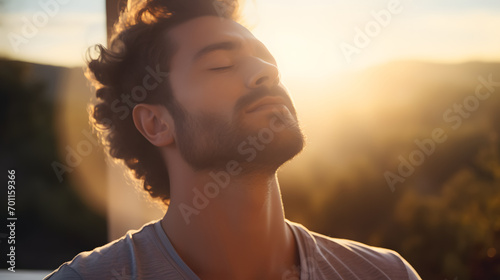 A detailed shot capturing a calm gentleman engaged in morning meditation, inhaling the crisp morning air.