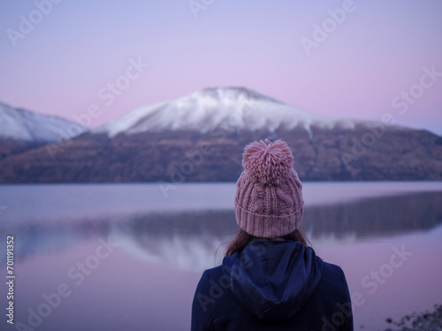 new zealand lake travel pastel pink sunset in cold beanie Dec 2023 Background Scenic beautiful