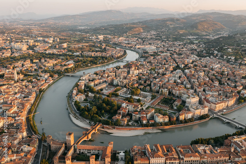 Aerial drone view of sunrise in Verona, Italy with the Adige river.