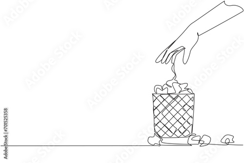 Single one line drawing hand throws wadded paper into wire mesh trash can. Always fail to write down ideas. A lot of paper is wasted. Wasteful. Stagnant. Continuous line design graphic illustration